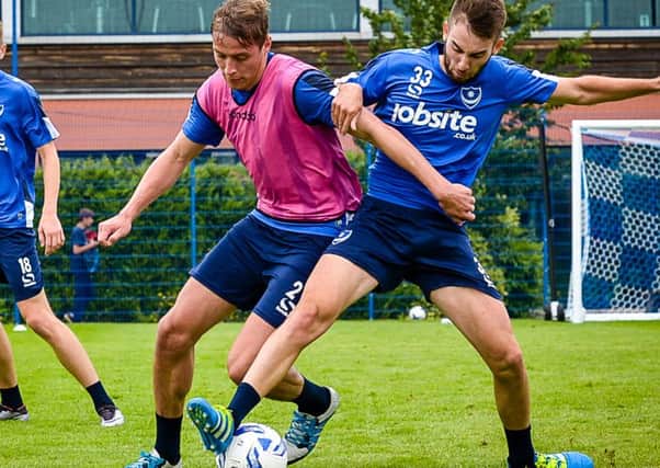 Tom Davies, left, and Ben Close challenge for the ball during pre-season training Picture: Colin Famery