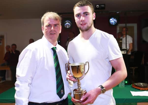 Grant Smith receives the fans' player of the year trophy / Picture by Tim Hale