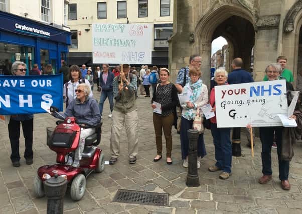Campaigners from the 38 degrees group handed out leaflets explaining plans to change the way NHS funding is allocated to mark the organisation's 68th birthday.