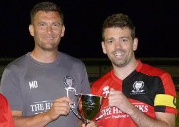 Hassocks joint manager Mark Dalgleish and skipper with the Ann John Memorial Trophy