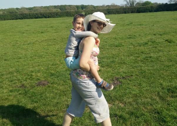 Crawley Down Slimming World consultant Holly Jones with her son Miles after her three stone weight loss - picture submitted