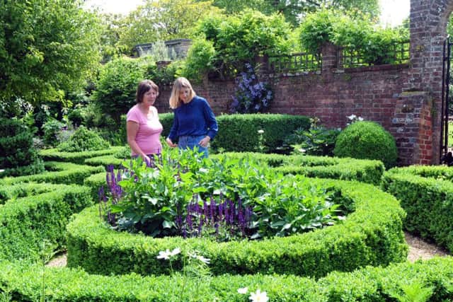 Lady Mersey and head gardener Louise Elliott in the knot garden at Bignor Park ks16000789-1