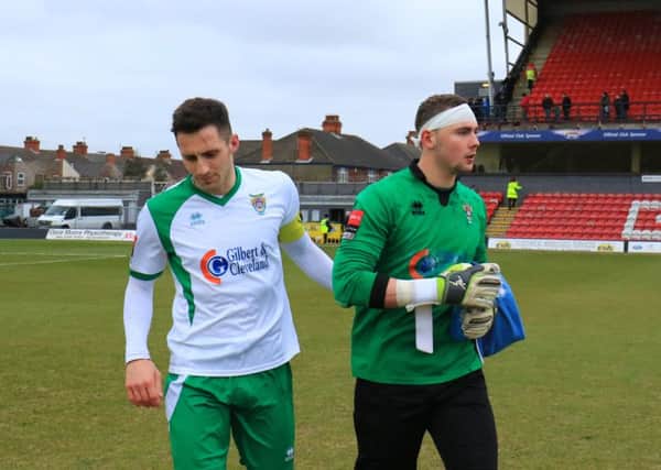 Grant Smith - pictured with Jason Prior after sustaining a head injury at Grimsby - has left the Rocks / Picture by Tim Hale