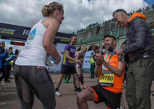 Runner Ben Klinkenbergh proposes to his girlfriend Hannah Jennings at the end of the Brighton Marathon SUS-160418-134215001