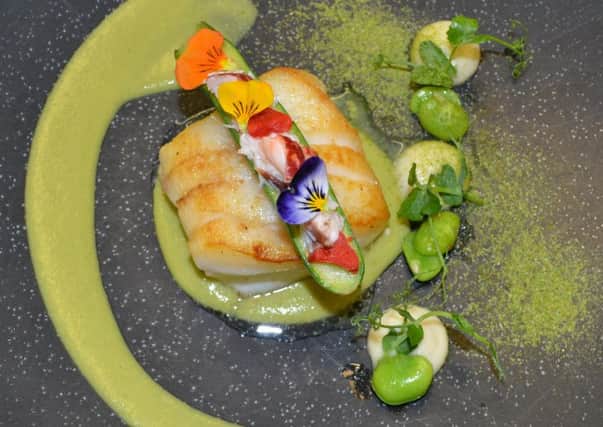 Broad bean puree with roast cod loain and seafood stuffed courgettes