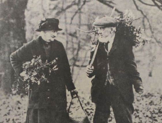 Granny and Granddad Clarke gathering holly near their Petworth home at Christmas 1934