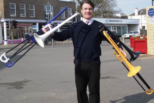 Roger Clayden with the plastic trombones bought with his Bognor Regis Town Council grant