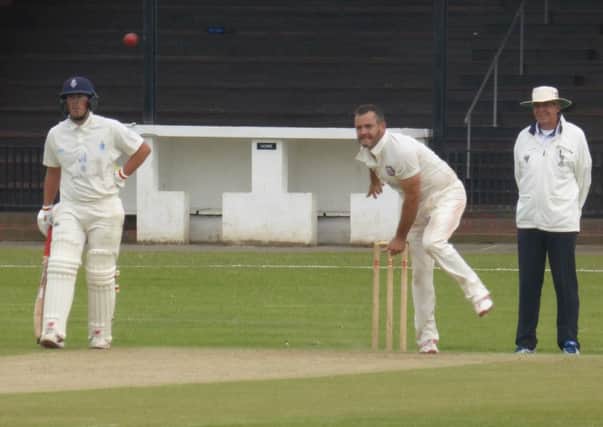Sam Roberts bowling for Bexhill against Billingshurst. Picture by Simon Newstead (SUS-160907-222831002)