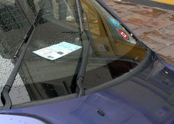 blue badge displayed in windscreen gv SUS-150307-135045001