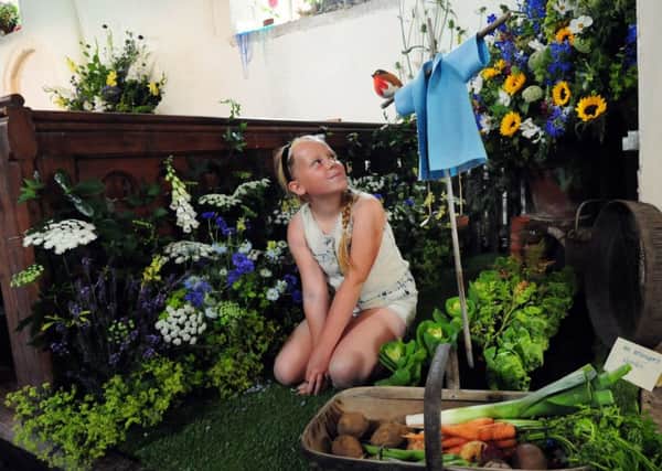 Licia Miles, eight, in the arrangement depicting Mr McGregors Garden. Pictures: Kate Shemilt ks16000839-1