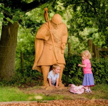 Beautifully carved oak figures  including this Saxon axe warrior  have been installed across the battlefield, evoking the two armies and the drama of the battle. Â© English Heritage SUS-160713-145404001