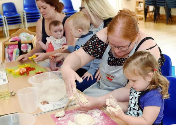 Zoe Spicer cooking with two-year-old daughter Meg on the Cooking With Confidence course LP1600081