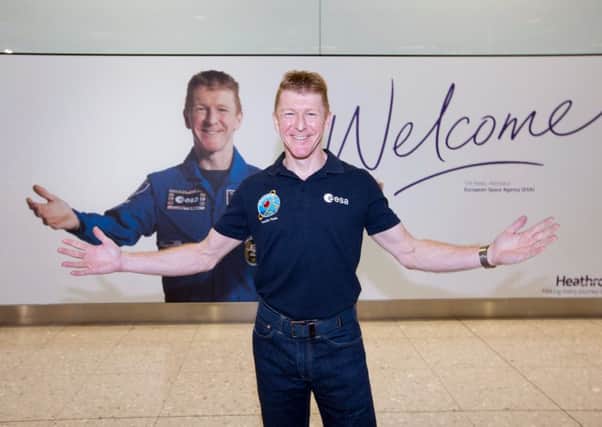 Astronaut Tim Peake was greeted by a welcome poster of himself when he arrived back at Heathrow Airport