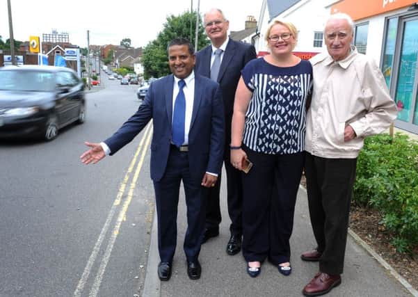 Haywards Heath Mayor Sujan Wickremaratchi, with Ahenground Ward cllrs for town and district - Howard Mundin and Anne Boutrup with a member of the public at the site of a new puffin crossing in Wivelsfield Road, Haywards Heath. Pic Steve Robards  SR1623521