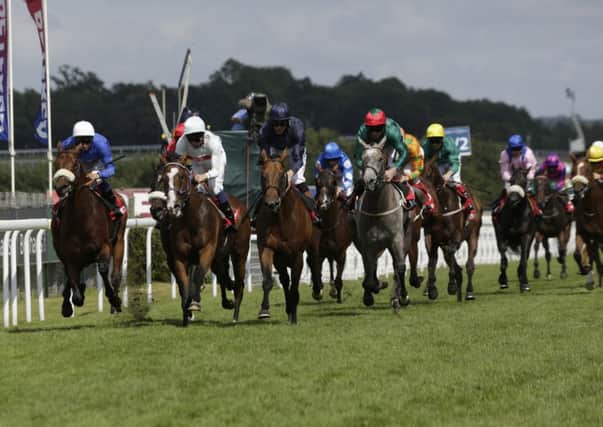 Wentworth on the way to winning the 2013 Betfred Mile / Picture by Clive Bennett