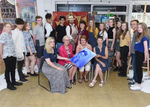 Artist in residence Jake Spicer, centre back, with students and, front, left to right, head of creative and performing arts Claire Vilday, Steyning DFAS chairman Ann Blakelock, NADFAS Sussex area co-ordinator for young art Susie Beale and Steyning DFAS young art co-ordinator Pam Childs. Pictures: Liz Pearce LP1600236