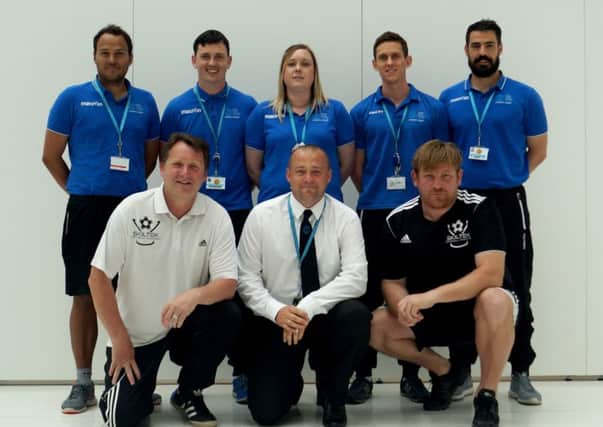 Staff from Sussex Coast College Hastings with Skiltek coaches Glyn White (front left) and Ben White (front right)