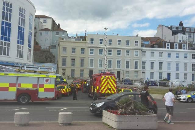 Emergency services at the scene of an incident in Marine Court. Photo by Charlotte Howard. SUS-160714-174213001