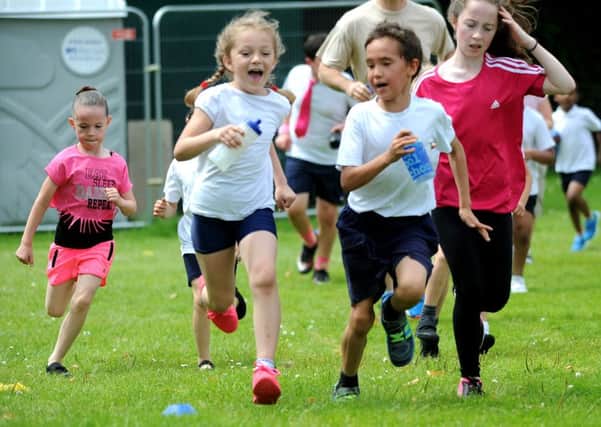 St Francis Assisi Catholic Primary School, Crawley hold a mini Race for Life for Cancer Research UK. Pic Steve Robards  SR1620268 SUS-160807-175716001