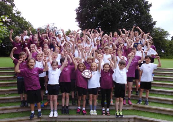The Windmills celebrate winning the Mid Sussex Athletics Sports Competition.