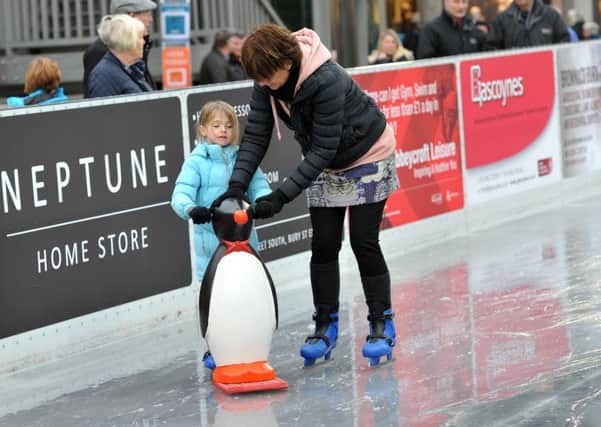 Pictured: Isabella Patterson and Grandma Debra Patterson having a go on the ice at Ourburystedmunds ice rink.  ANL-150712-013158009