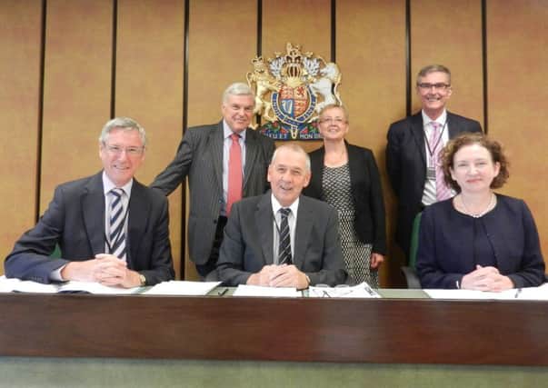 Judge John Tarling (centre) with collegues (listed clockwise) chamber president Judge Sioban McGrath,  Judge Michael Tildesley, Judge Jane Talbet (social entitlement chamber), deputy regional valuer Dallas Banfield and Judge Donald Agnen.