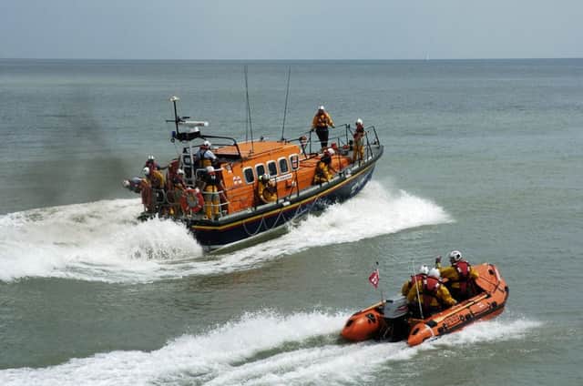 Hastings lifeboat crews. Photo by Paul Kelly ENGSUS00120120918130541