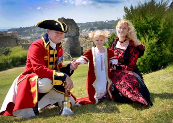 Hastings' town crier Jon Bartholomew with his wife Victoria and daughter Elizabeth. Pictured in the grounds of Hastings Castle by Sid Saunders. SUS-160725-163327001