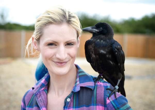 Vikkie Kenward and her adopted crow Fagin