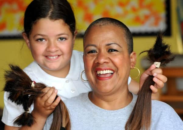 Aida Brooker with her daughter Phoenix after her brave cut