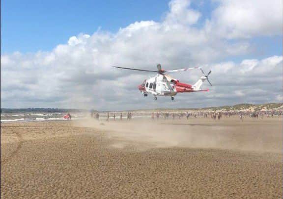 The Coastguard helicopter at Camber Sands. Photo by Emma B SUS-160724-173751001