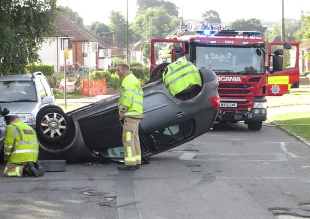 Car overturns in pot-hole strewn Greenway, Horsham. Photo: Cliff Comber SUS-160725-095124001