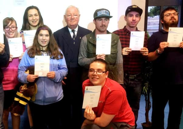 members of M8s - a Horsham-based group for young people with learning difficulties or additional needs, receive their Duke of Edinburgh certificates (photo submitted). SUS-160725-100331001