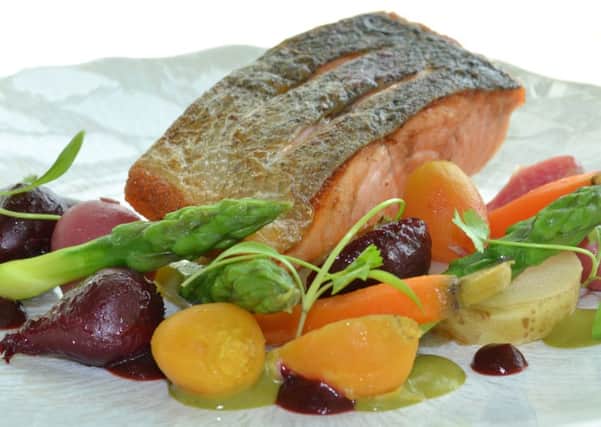 Home-cooked baby beetroot and beetroot puree with roast supreme of salmon