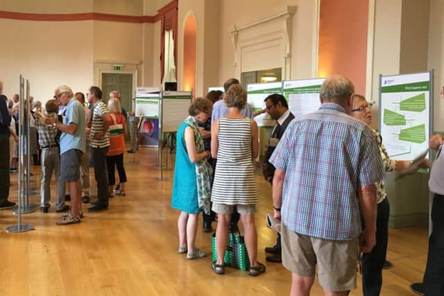 People viewing the plans at the first public exhibition held today in Chichester