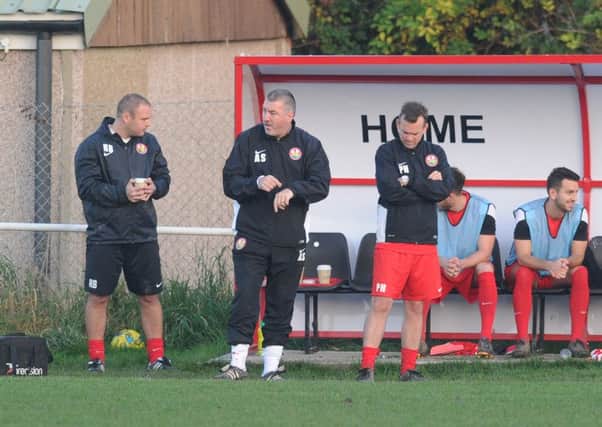 Alan Skipper (centre) has stepped down as Steyning boss