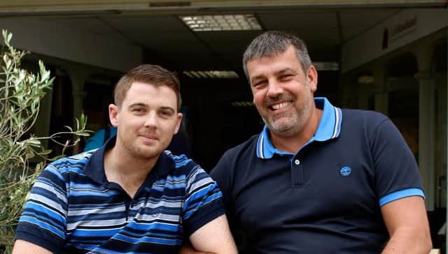 Phil Scudder has won a high court battle after he was left paralysed following a spinal operation in 2011. Pictured with his friend Matt Chaffe. SUS-160726-155904001