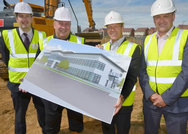 Fittleworth Medical Ltd's HR director Peter Waller, managing director Peter Hills, Amiri Construction managing director Grahame Pettit and project manager Lee Wilkinson with a CGI image of the new office being built on the A259 Courtwick Lane estate in Littlehampton.