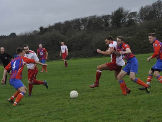 Reigning champions Peche Hill Select, pictured here against Battle Baptists last season, have withdrawn from the league ahead of the new campaign