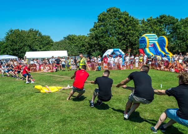 The tug-of-war competition at Jamie's Wish family fun day