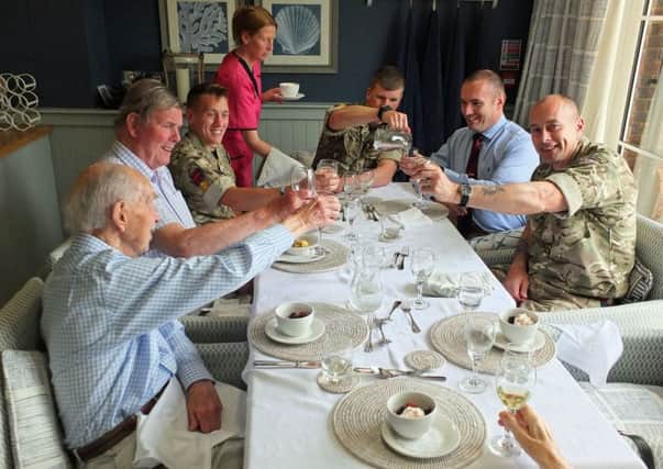 Ex-Royal Engineers Ian Lye Grant, John Benstead and Jack Lumley meet current and former members of the regiment over lunch at Colten Cares Wellington Grange in Chichester