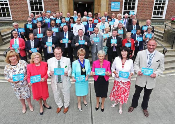 West Sussex county councillors demonstrate their opposition to hate crime outside County Hall in Chichester on Friday July 22 (photo submitted). SUS-160727-151442001