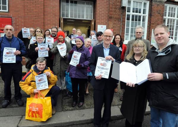 A petition to keep Bognor Post Office open was presented to MP Nick Gibb, centre, by Paul and Marion Wells, right. ks1600045--1