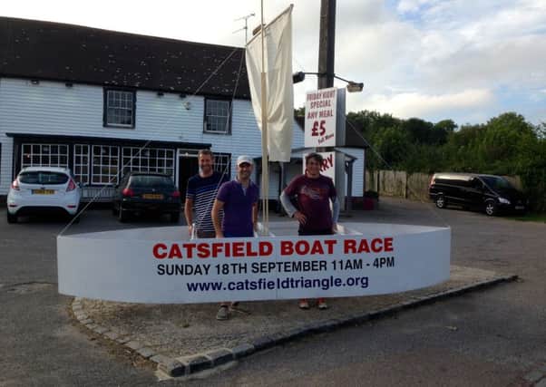 Catsfield Boat Race organisers with a homemade boat to use in the race. Photo by Scott Lavocah SUS-160408-141145001