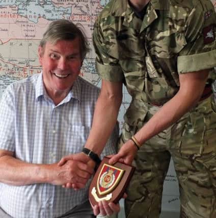 Ex-Royal Engineer John Benstead receives his regimental plaque from Corporal Anthony Hickman