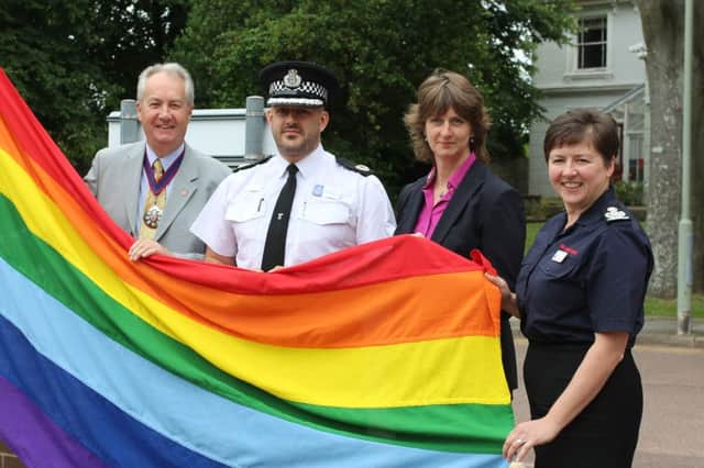 Flying the flag for Brighton Pride 2016. Pictured (from left) are: Cllr Michael Ensor, Assistant chief constable Laurence Taylor, Becky Shaw and Deputy chief fire officer Dawn Whittaker SUS-160108-132510001
