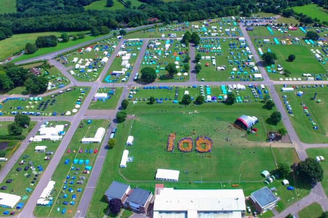 An aerial view of site at Ardingly with Cubs forming into the shape of 100