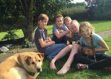 Bodie with the Relf children, who adore their family pet