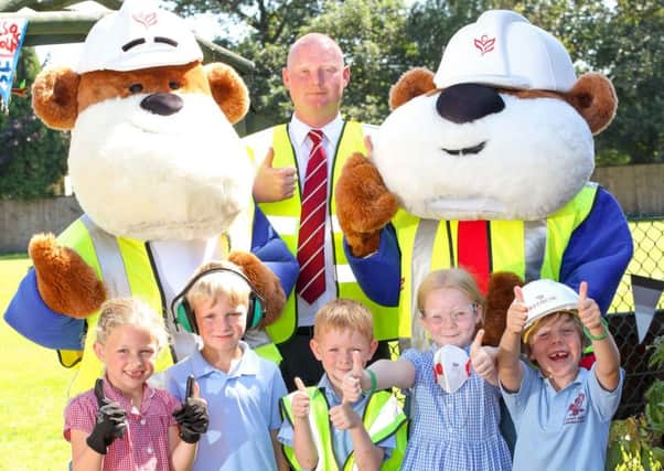 Mascots Buster and Buddy visited schools with safety message. Pic: Submitted