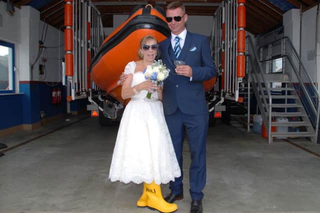 Rye Harbour lifeboat crew members Sharon Gosna and Tony Peters got married on July 9. Photo courtesy of Rye Harbour RNLI SUS-160308-134623001